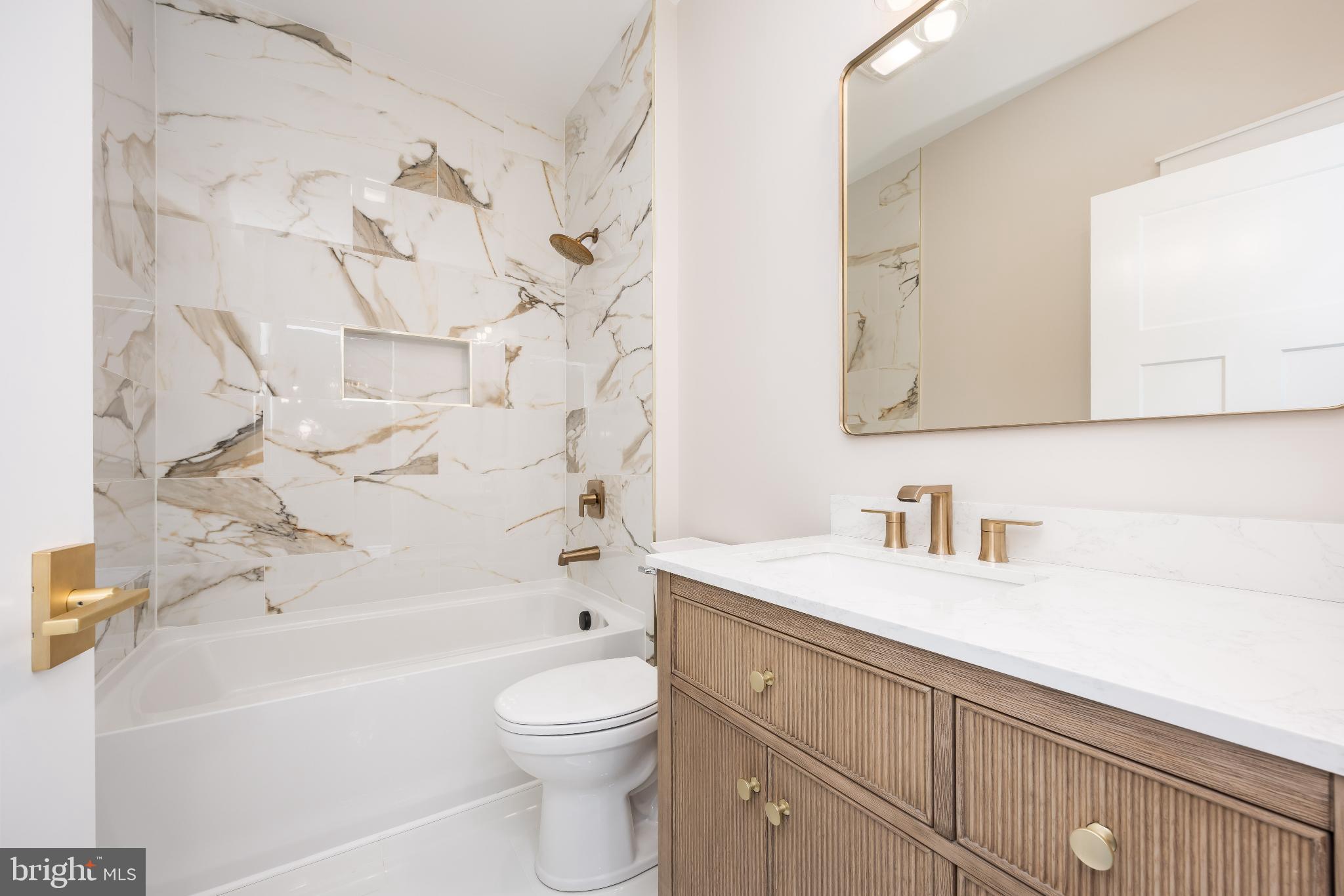 19438 Parsons Road Georgetown, DE 19947 - Photo 47 of 62 Elegant bathroom with marble accents.