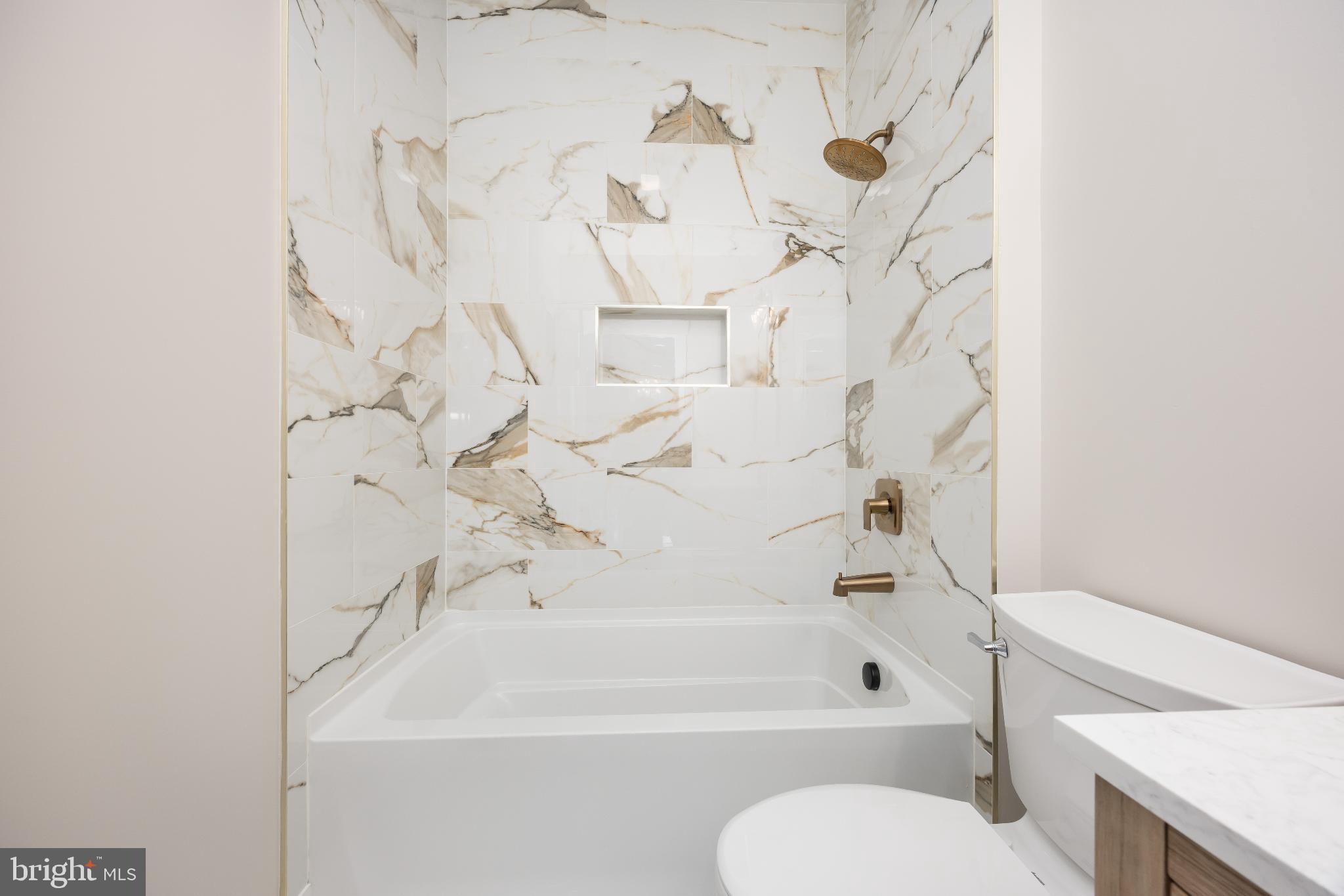 19438 Parsons Road Georgetown, DE 19947 - Photo 48 of 62 Elegant marble bath retreat with modern fixtures.