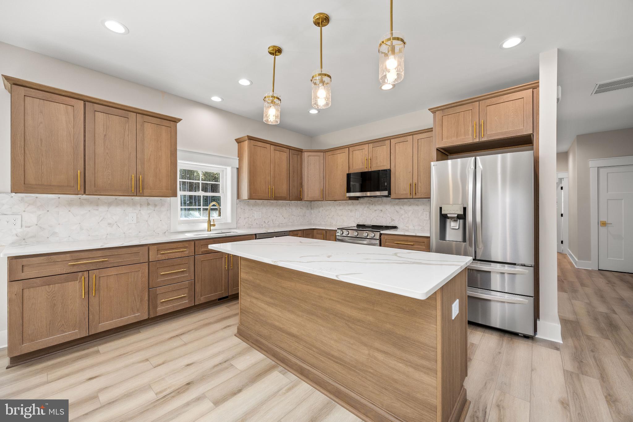 19438 Parsons Road Georgetown, DE 19947 - Photo 10 of 62 Modern kitchen with elegant wood cabinetry.
