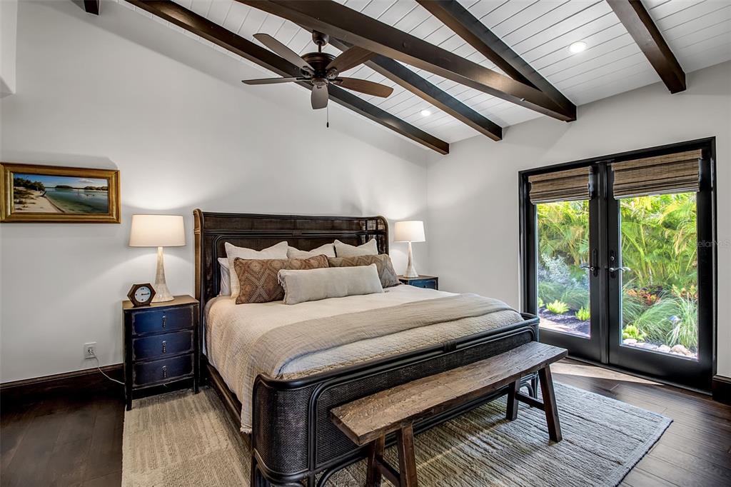 121 North Casey Key Road Osprey, FL 34229 - Photo 35 of 63 a bedroom with a bed and a window