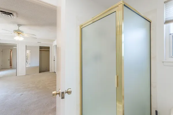 a view of a big room with closet and a bathroom