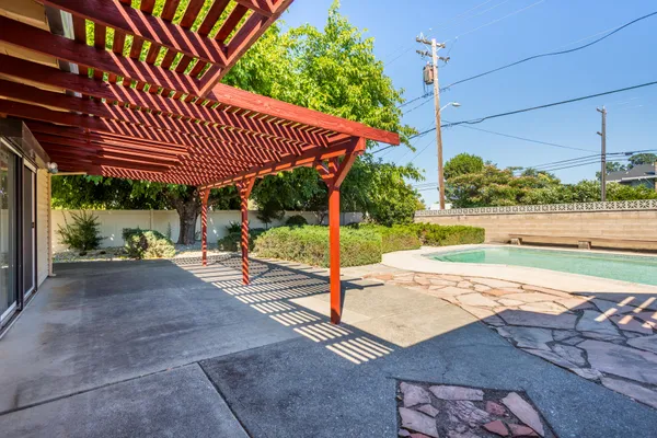 a view of a backyard with a patio