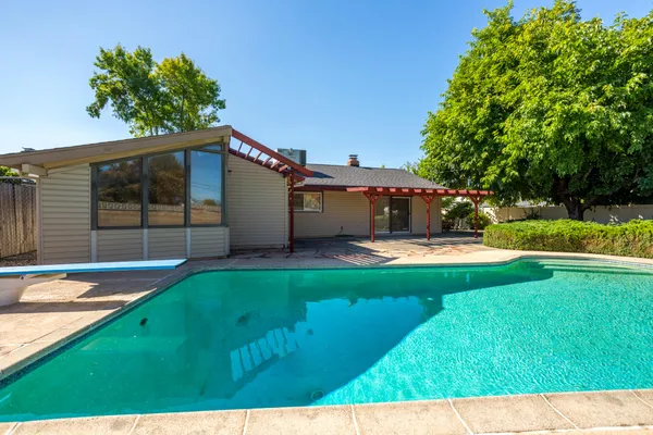 a view of a house with a swimming pool