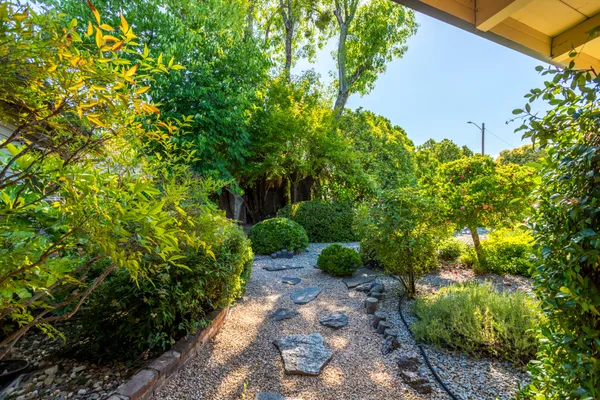 a backyard of a house with lots of green space