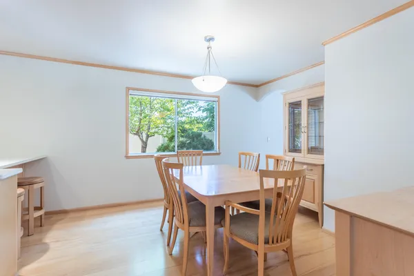 a dining room with furniture window and outside view