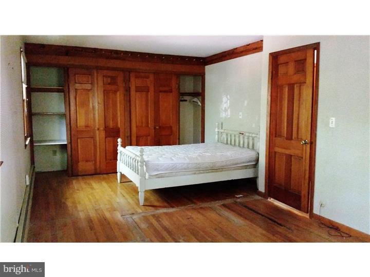 9 Stone Hill Road Allentown, NJ 08501 - Photo 11 of 24 a room with a bed and a cabinets