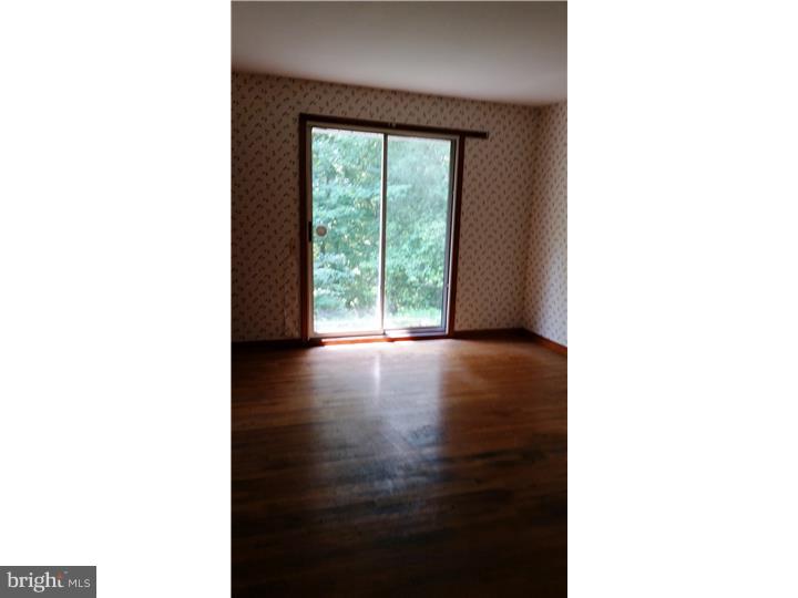 9 Stone Hill Road Allentown, NJ 08501 - Photo 18 of 24 a view of a room with a window and wooden floor