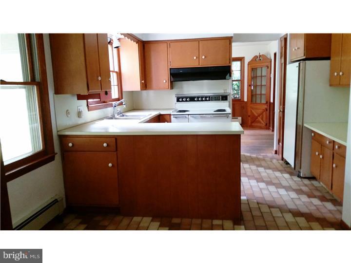 9 Stone Hill Road Allentown, NJ 08501 - Photo 5 of 24 a kitchen with a refrigerator and a stove