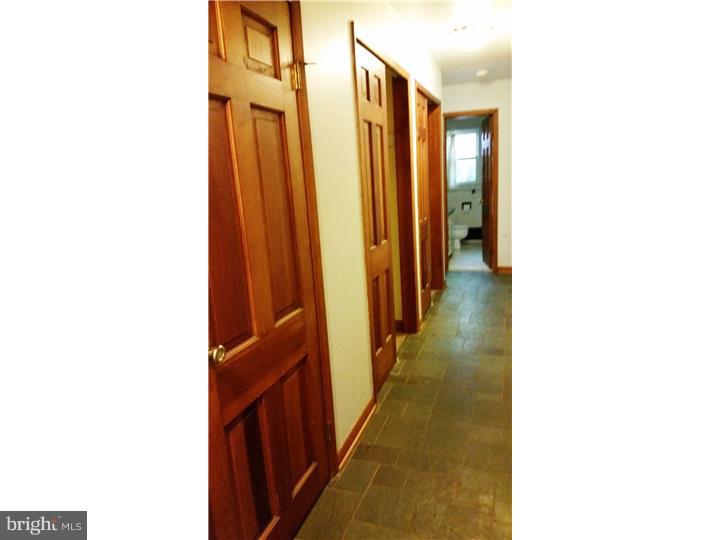 9 Stone Hill Road Allentown, NJ 08501 - Photo 10 of 24 a view of a hallway with wooden floor