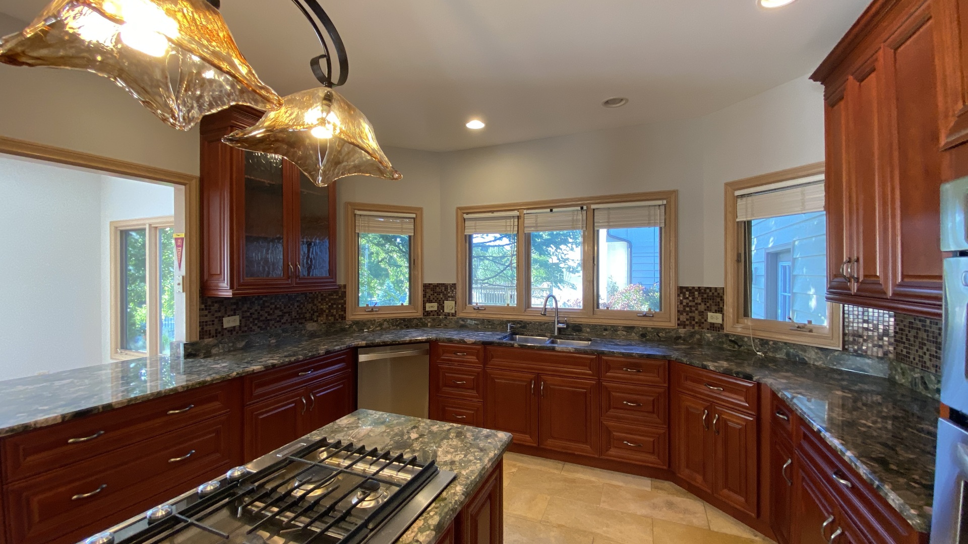 817 Turnbridge Circle Naperville, IL 60540 - Photo 22 of 42 a large kitchen with kitchen island granite countertop a large island in the center and stainless steel appliances