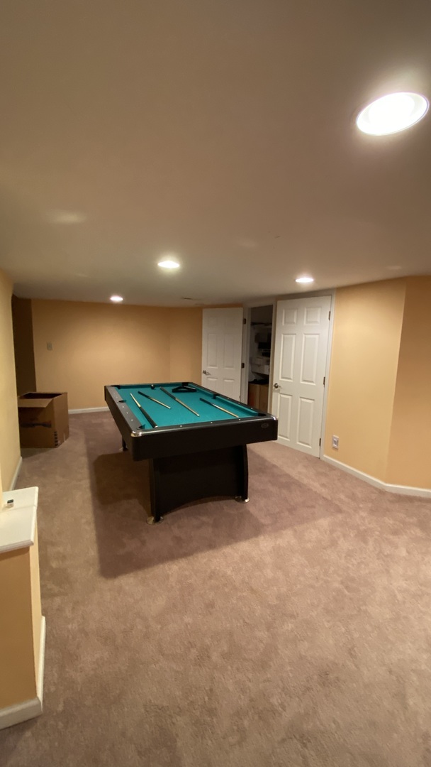 817 Turnbridge Circle Naperville, IL 60540 - Photo 24 of 42 a room with pool table and a wooden floor