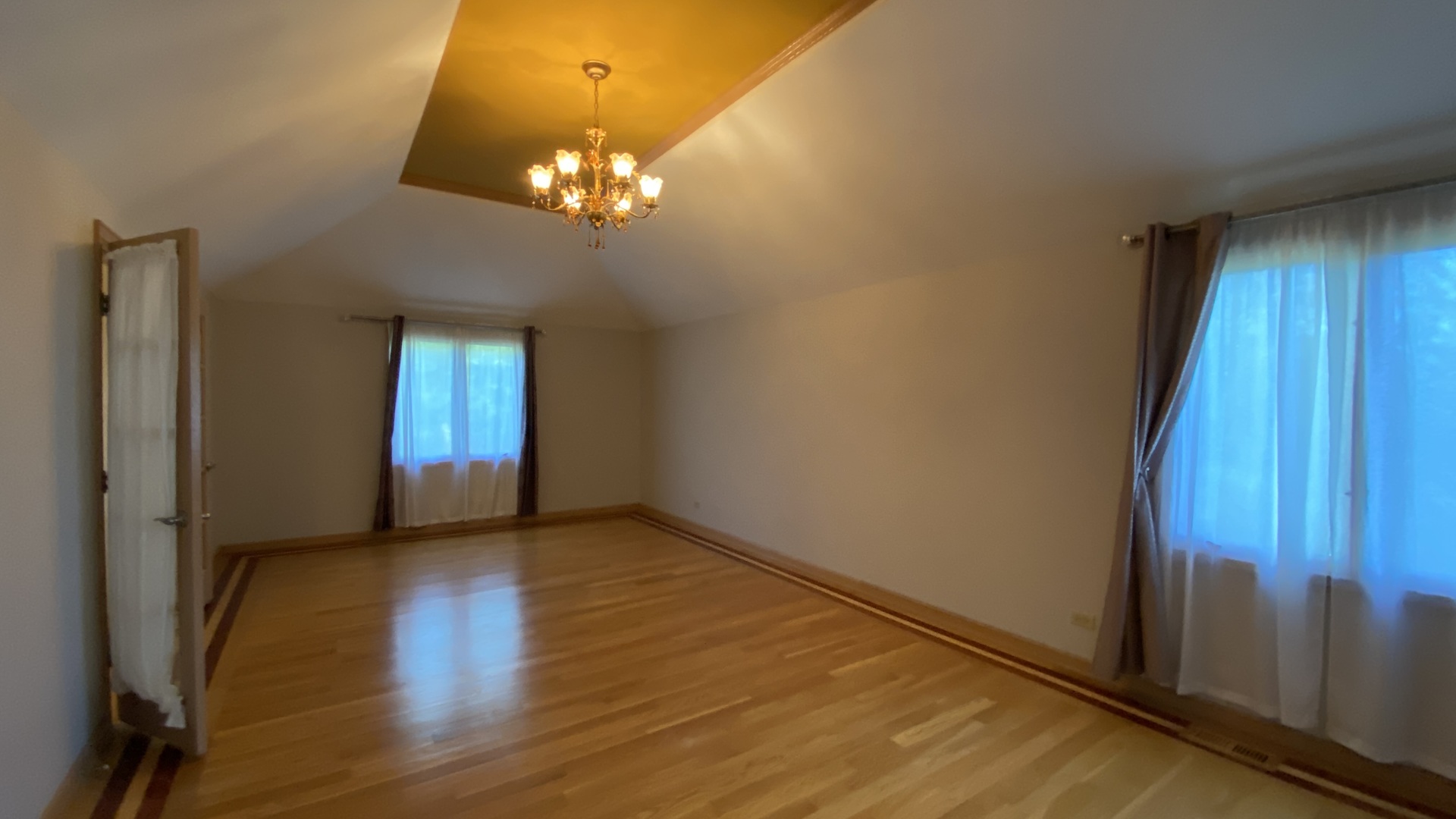 817 Turnbridge Circle Naperville, IL 60540 - Photo 26 of 42 a view of an empty room with window and wooden floor