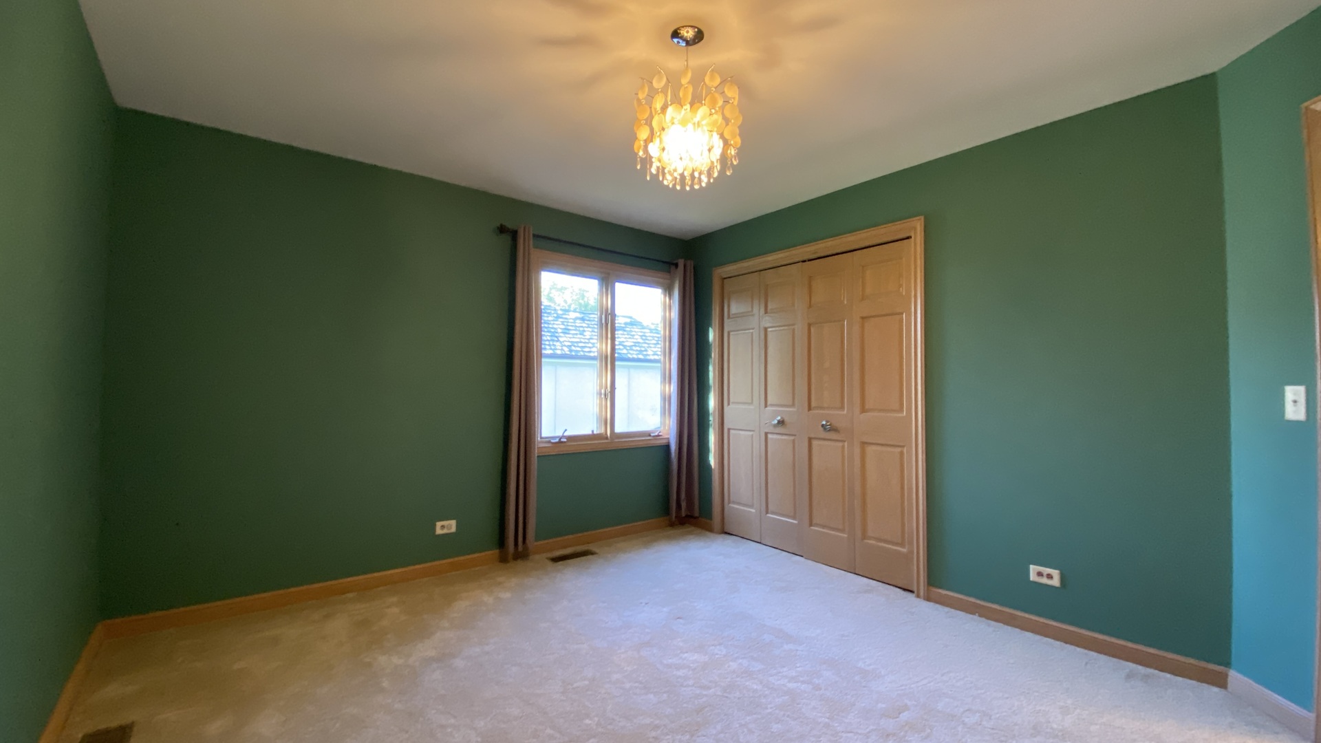 817 Turnbridge Circle Naperville, IL 60540 - Photo 35 of 42 a view of an empty room with window and chandelier fan