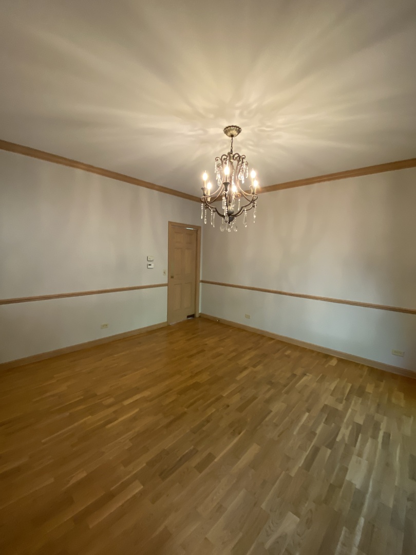 817 Turnbridge Circle Naperville, IL 60540 - Photo 7 of 42 a view of a livingroom with a chandelier fan