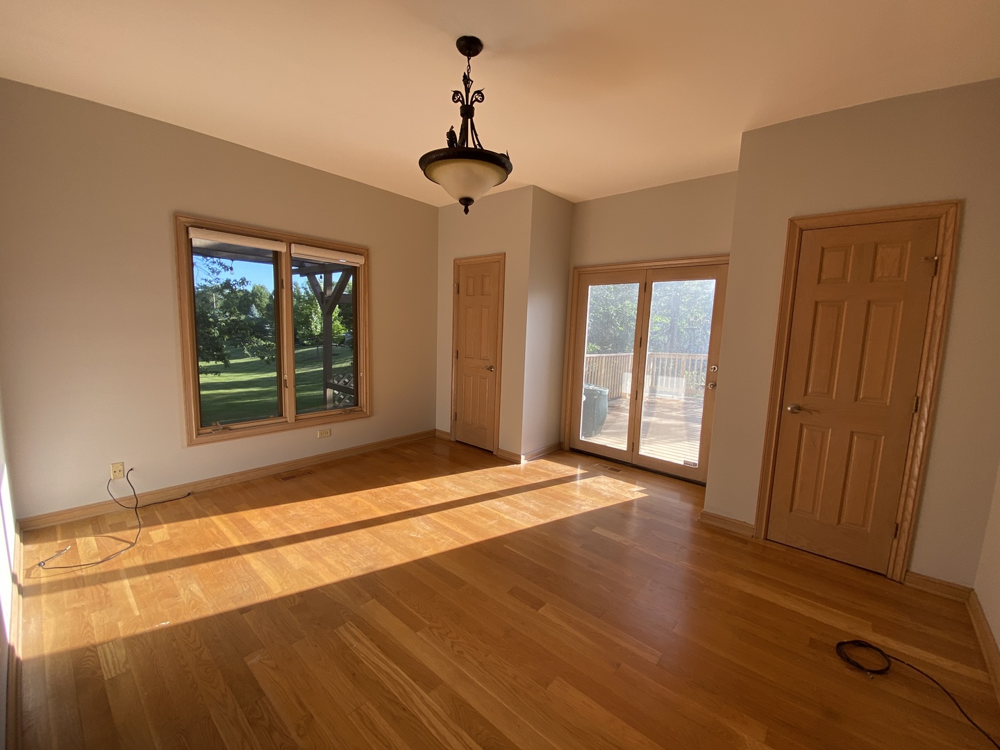 817 Turnbridge Circle Naperville, IL 60540 - Photo 10 of 42 a view of an empty room with wooden floor and a window