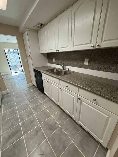 3326 Farragut Street, Unit 6D Hollywood, FL 33021 - Photo 8 of 25 a kitchen with granite countertop a sink and cabinets