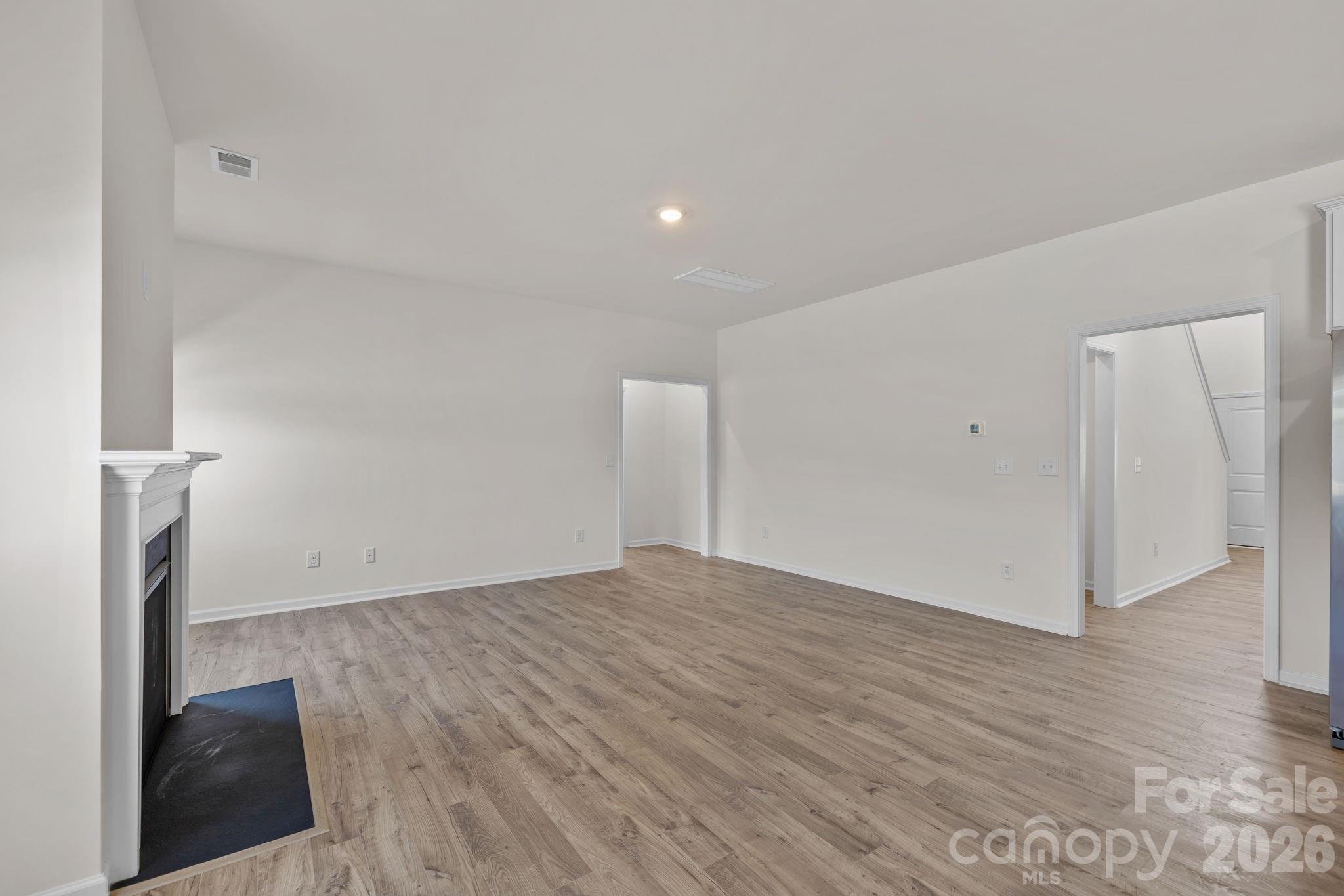 463 Brick House Road York, SC 29745 - Photo 16 of 35 a view of empty room with wooden floor and fan