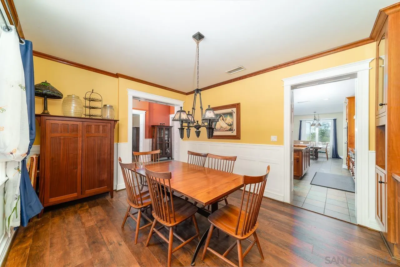 32070 Vía Vera Bonsall, CA 92003 - Photo 17 of 51 a dining room with furniture and window