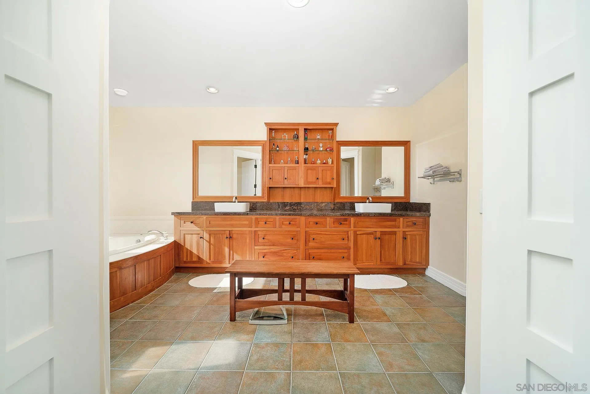 32070 Vía Vera Bonsall, CA 92003 - Photo 21 of 51 a room with a table chairs and a kitchen view