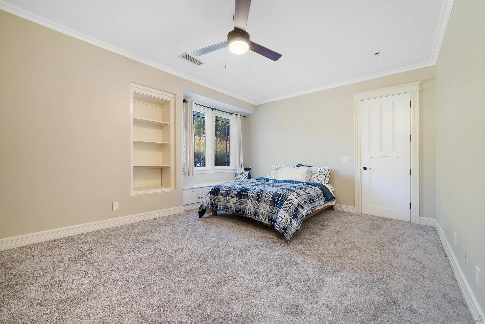 32070 Vía Vera Bonsall, CA 92003 - Photo 25 of 51 a bedroom with a bed and a chandelier