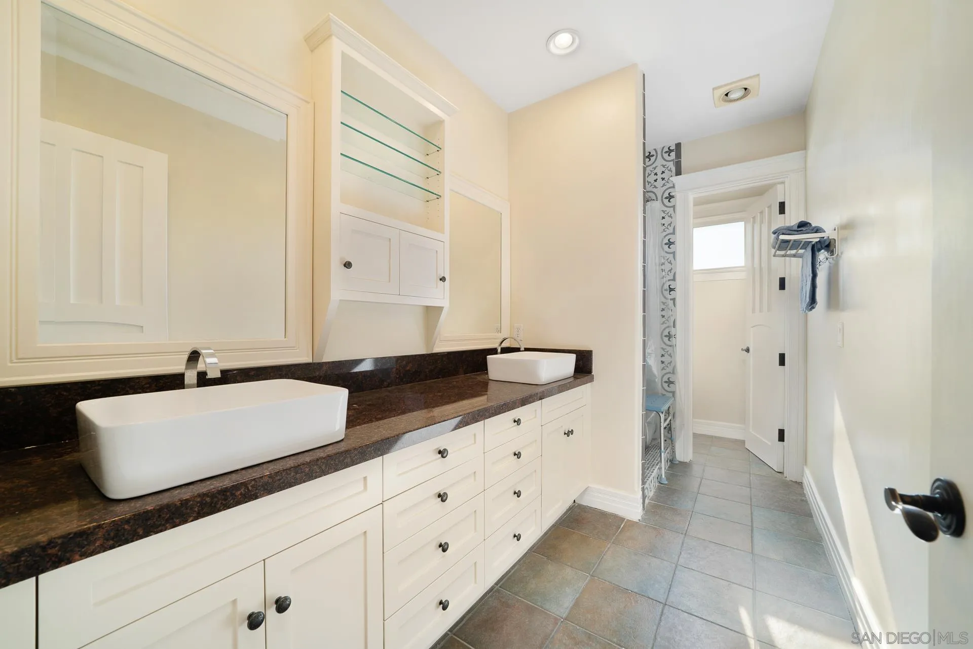 32070 Vía Vera Bonsall, CA 92003 - Photo 27 of 51 a bathroom with a sink and a mirror