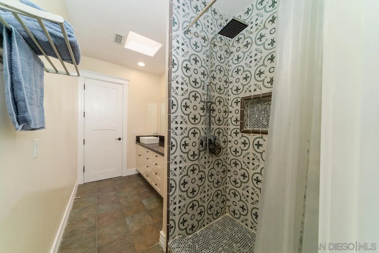 32070 Vía Vera Bonsall, CA 92003 - Photo 29 of 51 a bathroom with a shower and a sink