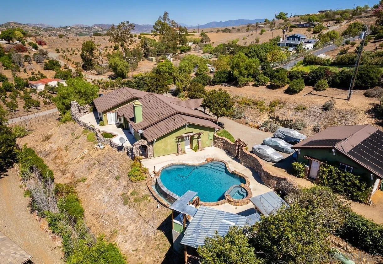 32070 Vía Vera Bonsall, CA 92003 - Photo 36 of 51 an aerial view of a house with a swimming pool