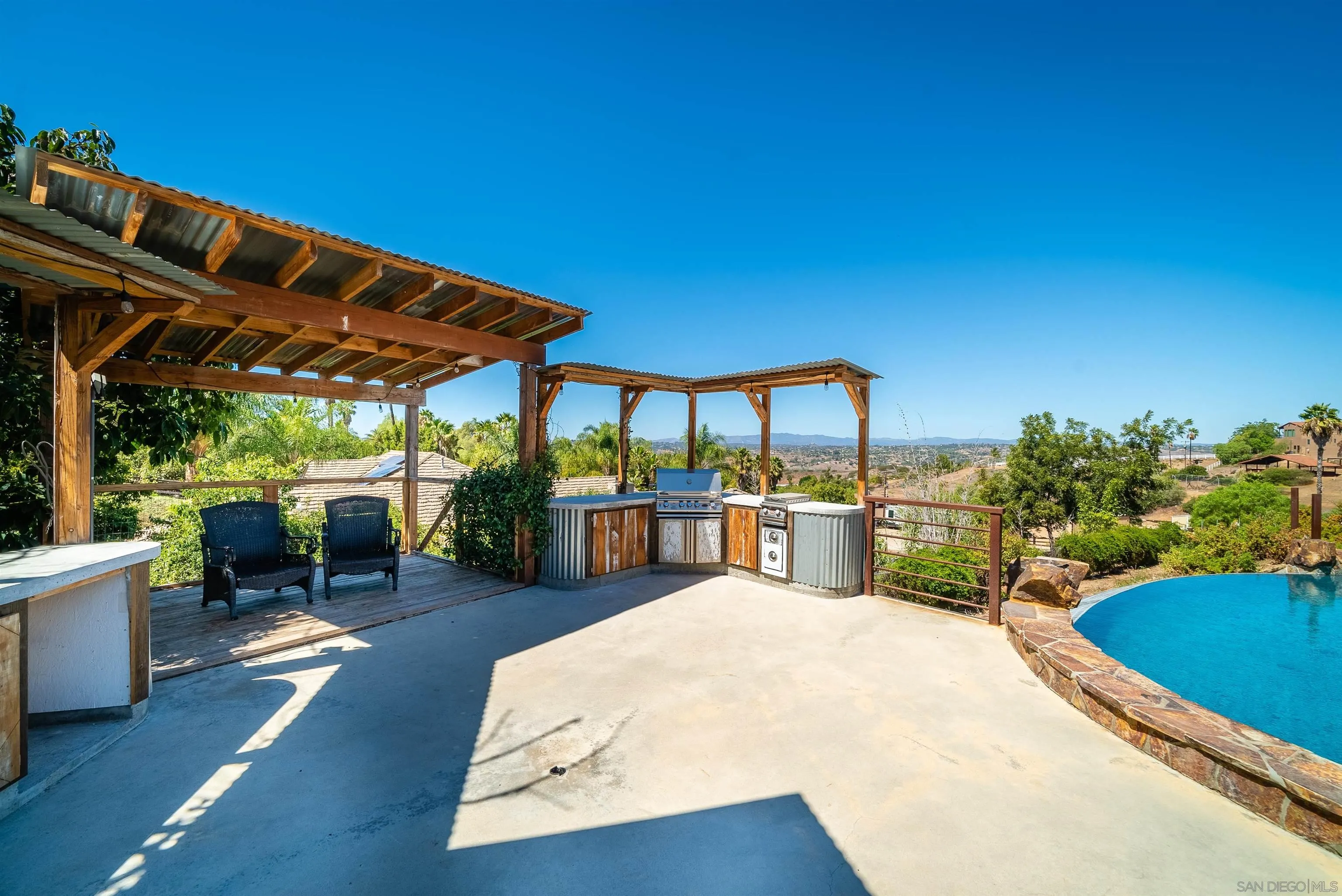 32070 Vía Vera Bonsall, CA 92003 - Photo 39 of 51 a view of a patio with swimming pool