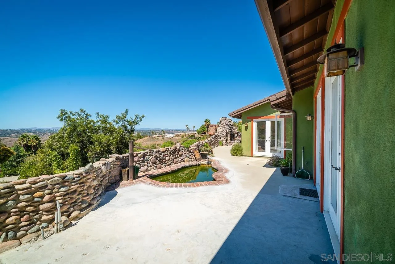 32070 Vía Vera Bonsall, CA 92003 - Photo 41 of 51 a view of a house with backyard and sitting area