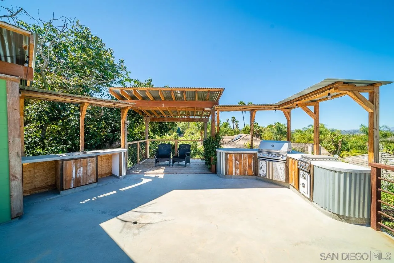 32070 Vía Vera Bonsall, CA 92003 - Photo 44 of 51 a view of a swimming pool with a patio