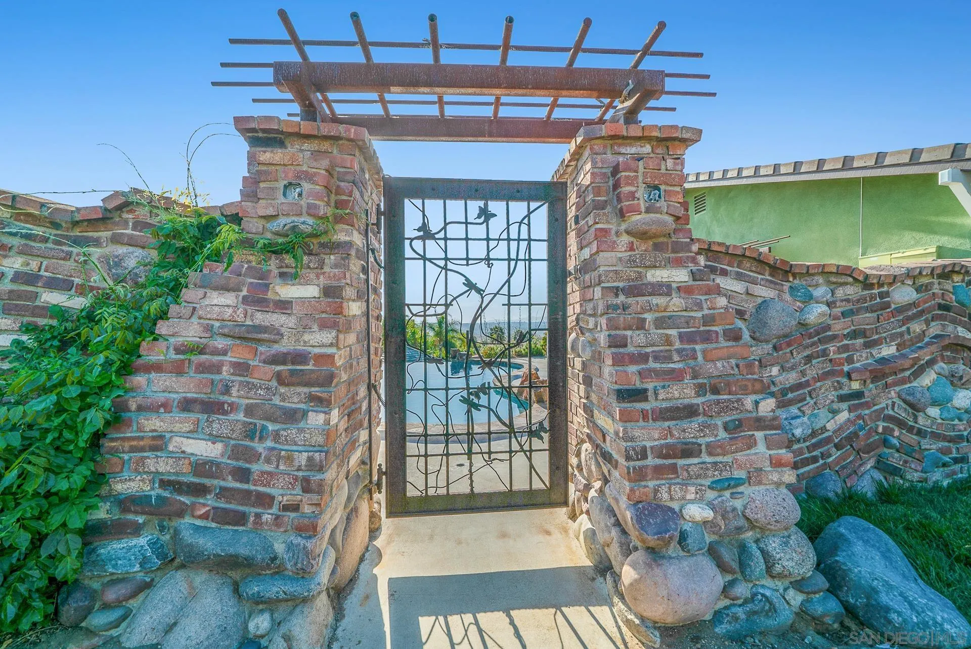 32070 Vía Vera Bonsall, CA 92003 - Photo 48 of 51 a view of a patio with table and chairs and potted plants