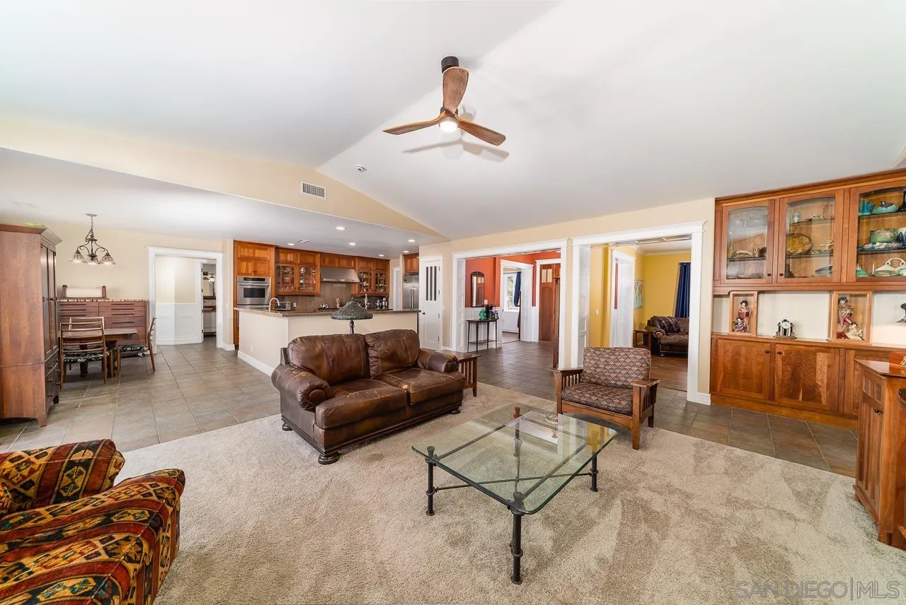 32070 Vía Vera Bonsall, CA 92003 - Photo 8 of 51 a living room with furniture and a large window