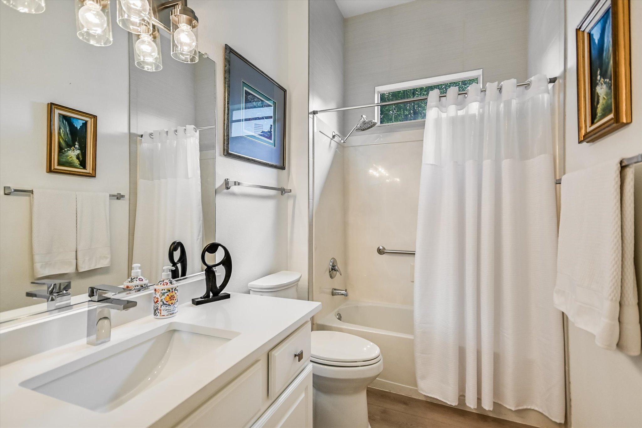 105 Stetson Circle Georgetown, TX 78633 - Photo 15 of 21 The secondary bathroom features a crisp white vanity, a sleek faucet, and a combination shower-tub.