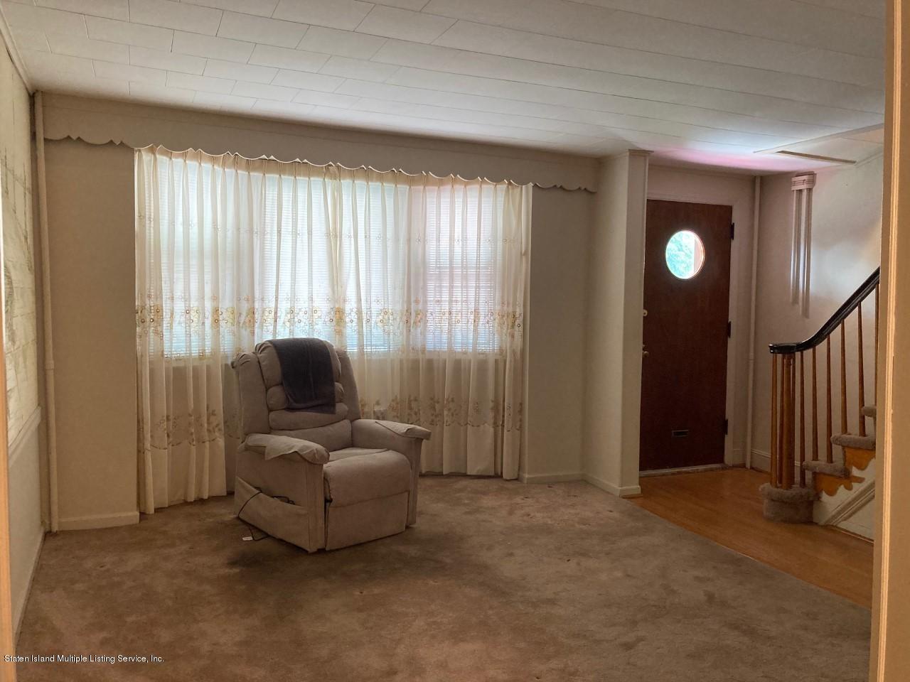 449 Lake Street Brooklyn, NY 11223 - Photo 2 of 14 a living room with furniture and a window