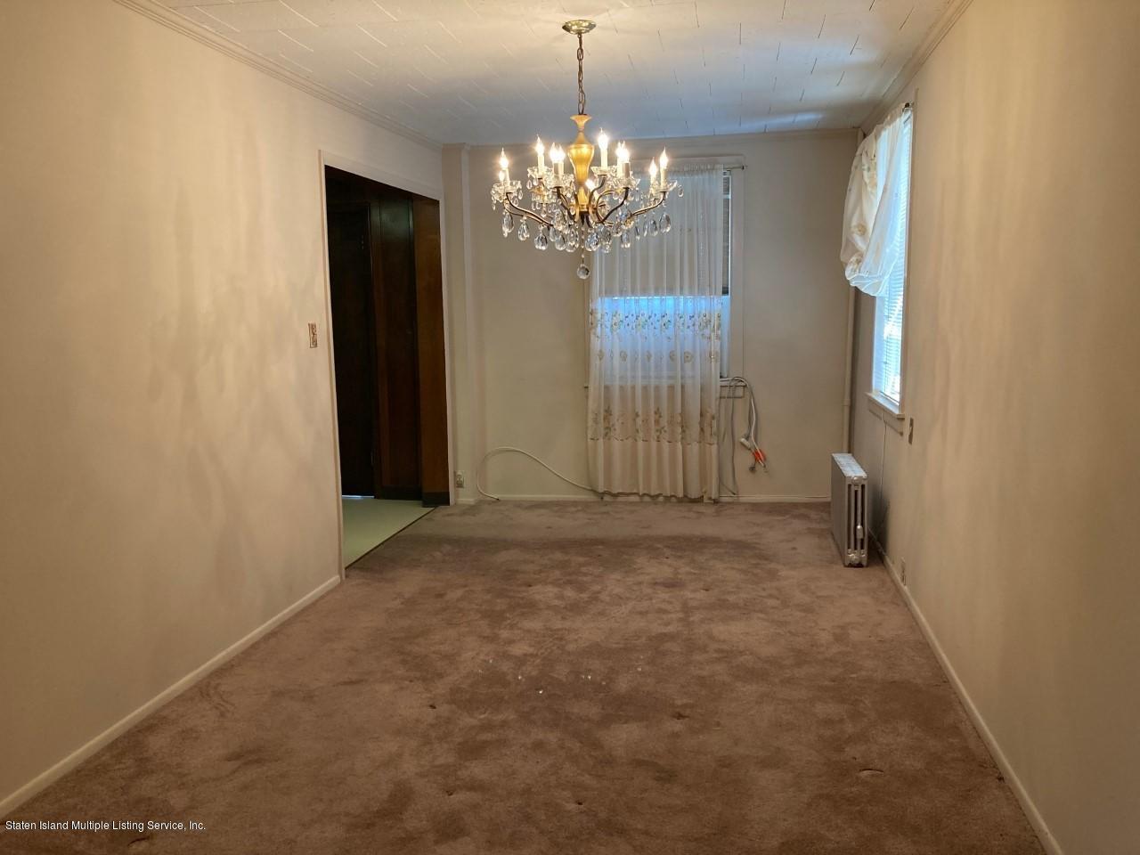 449 Lake Street Brooklyn, NY 11223 - Photo 4 of 14 a view of a chandelier in big room and chandelier