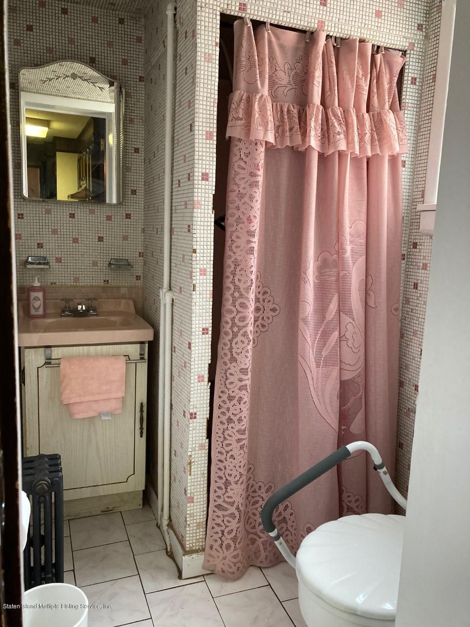 449 Lake Street Brooklyn, NY 11223 - Photo 8 of 14 a bathroom with a sink toilet and shower