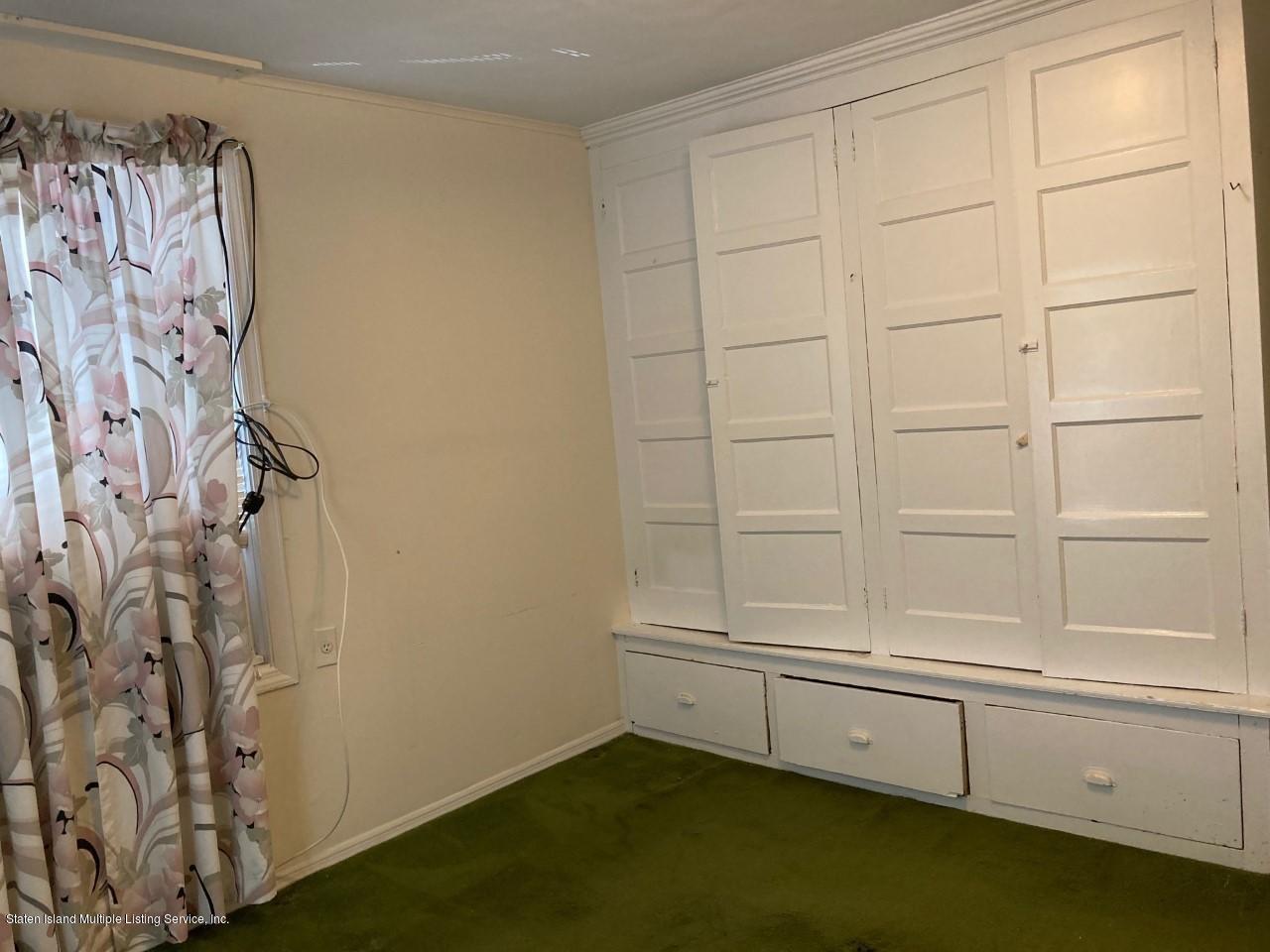 449 Lake Street Brooklyn, NY 11223 - Photo 10 of 14 a view of a closet area with racks on the wall