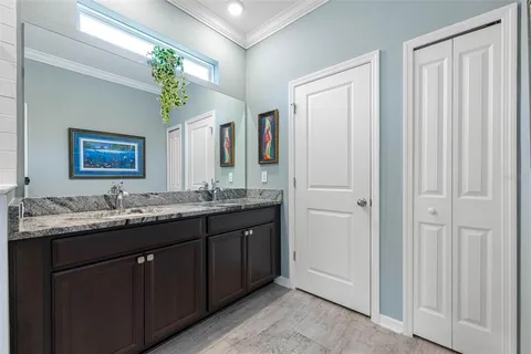 a view of walk in closet with clothes