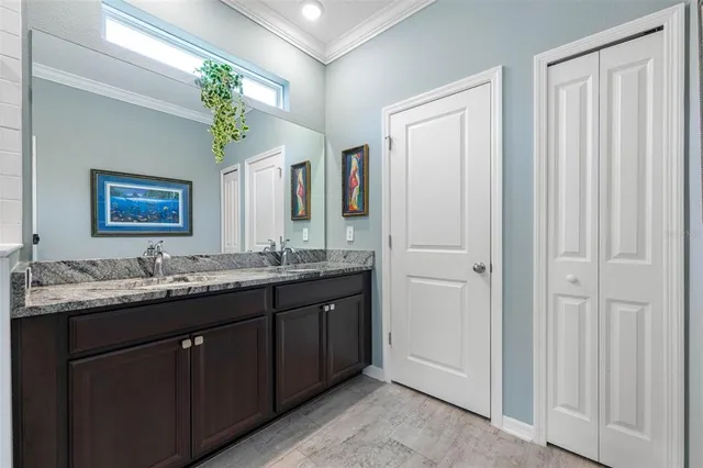 a view of walk in closet with clothes