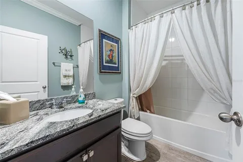 a room with table chairs and windows