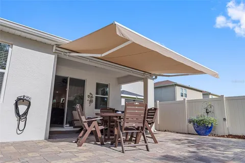 a patio with table and chairs