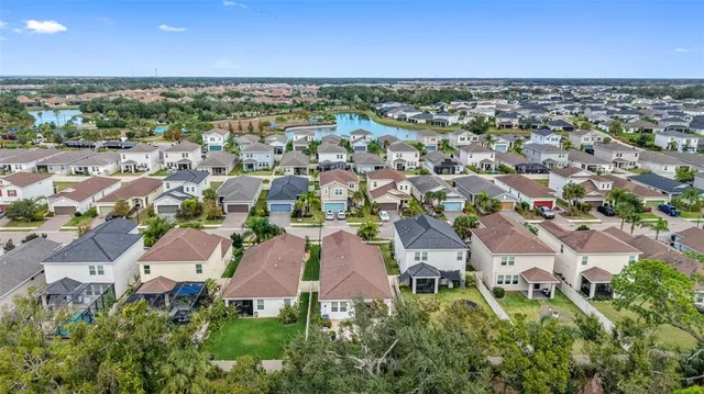 an aerial view of a city with lots of residential buildings