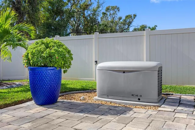 a view of a garden with wooden fence