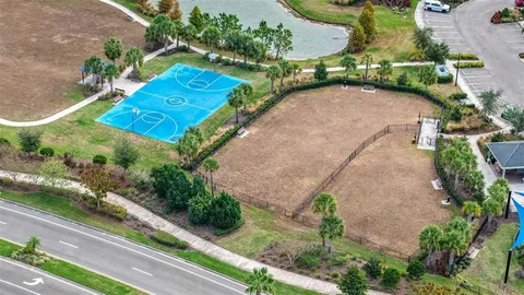 an aerial view of house with yard swimming pool and outdoor seating