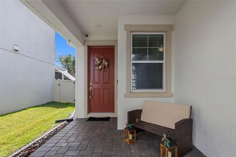 a room that has a bed and a chair in it