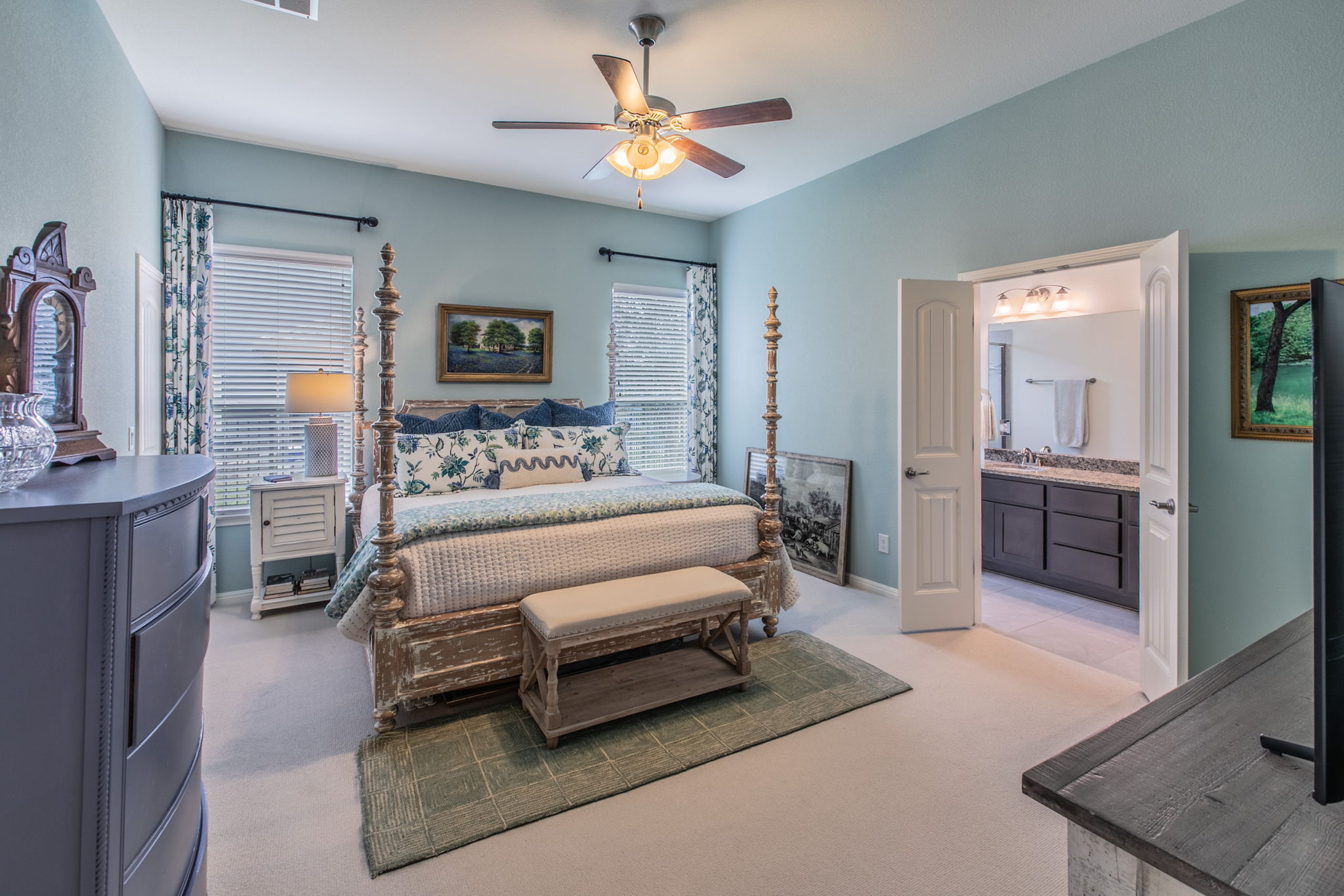 231 Simon Kyle, TX 78640 - Photo 12 of 29 Bedroom featuring a vaulted ceiling with a ceiling fan, dual windows with blinds, and carpet flooring