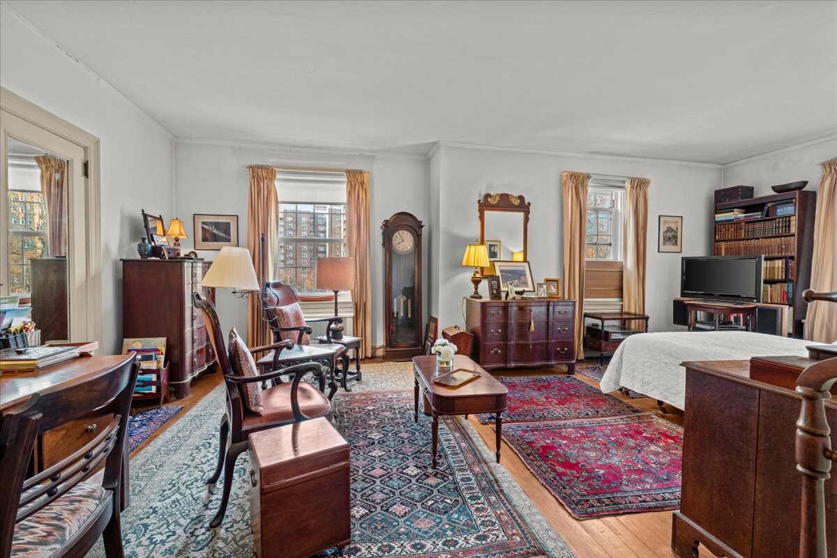 525 West 238th Street, Unit 2B Bronx, NY 10463 - Photo 13 of 31 a living room with fireplace furniture and a flat screen tv