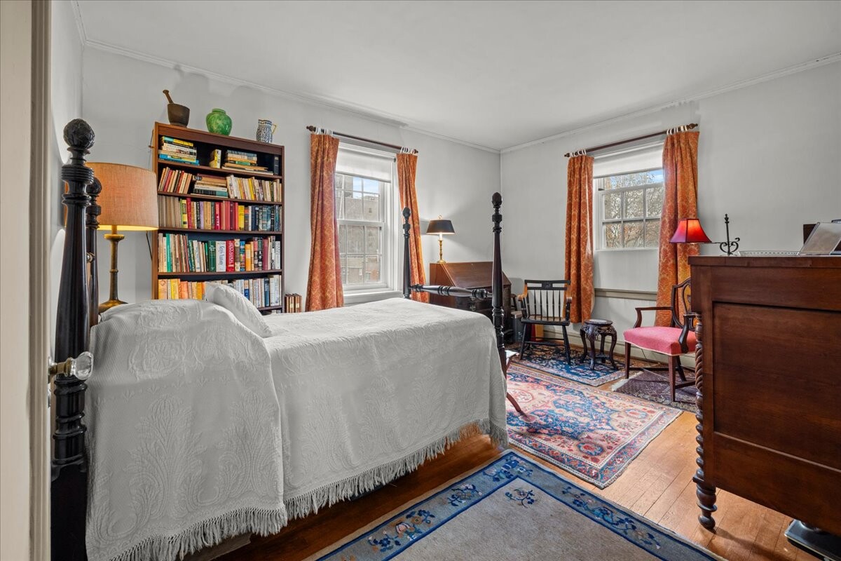 525 West 238th Street, Unit 2B Bronx, NY 10463 - Photo 16 of 31 a bed sitting in a bedroom next to a window