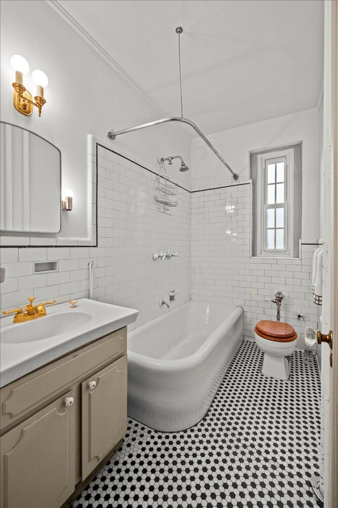 525 West 238th Street, Unit 2B Bronx, NY 10463 - Photo 19 of 31 a bathroom with a sink a toilet and shower