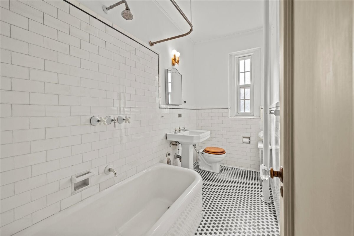 525 West 238th Street, Unit 2B Bronx, NY 10463 - Photo 20 of 31 a bathroom with a bathtub a sink and a shower